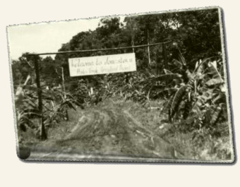 The sign reads: "Welcome to Jonestown, Peoples Temple Agricultural Project"