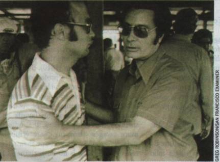 The Rev. Jim Jones (right) with an unidentified man at Jonestown, November 18, 1978.